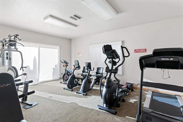 workout area with carpet and visible vents