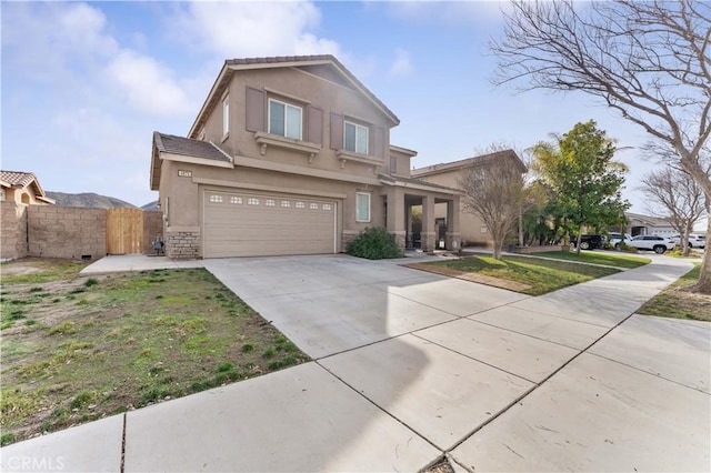 view of front facade featuring a garage and a front yard