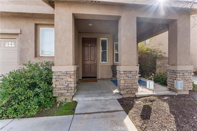 property entrance with a garage