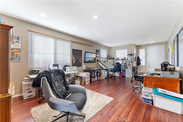 office space with dark wood-type flooring