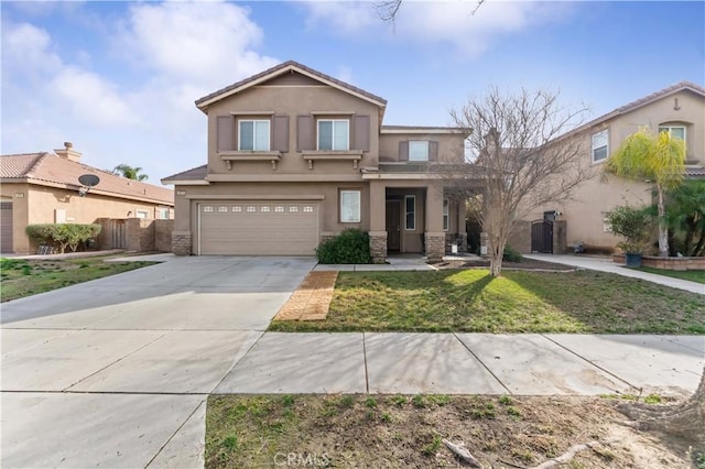 view of front of house with a garage and a front lawn