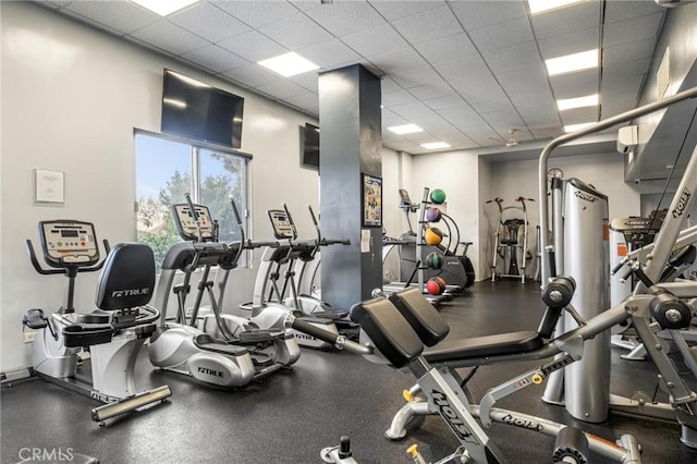 gym featuring a paneled ceiling