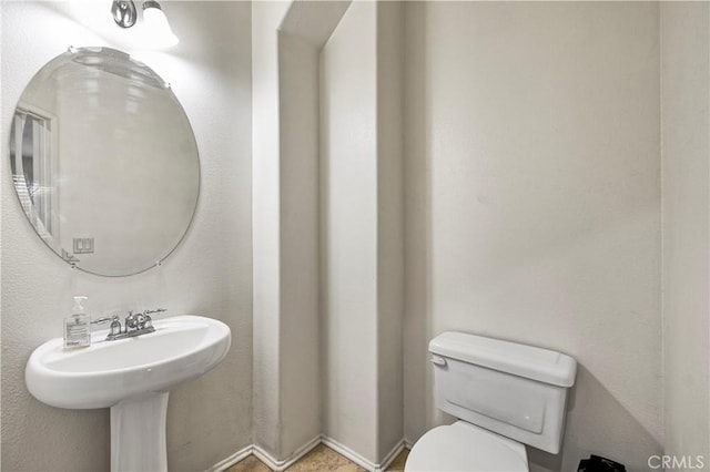 bathroom featuring sink and toilet