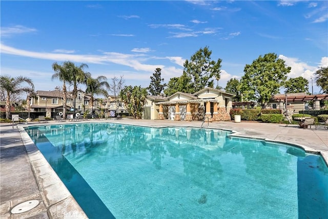 view of swimming pool with a patio