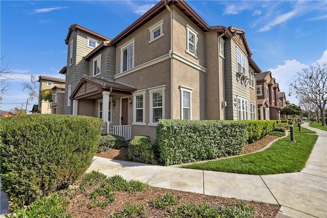 view of side of home featuring stucco siding