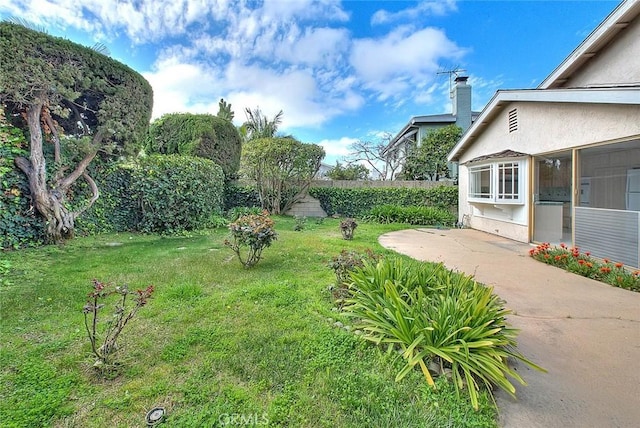 view of yard with a patio area and a sunroom