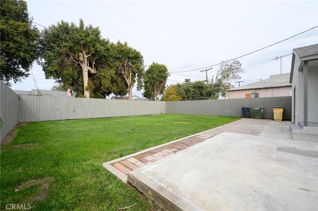 view of yard with a patio and a fenced backyard