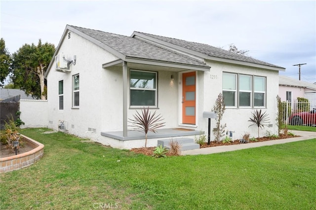 bungalow-style home with fence, stucco siding, a front lawn, and crawl space