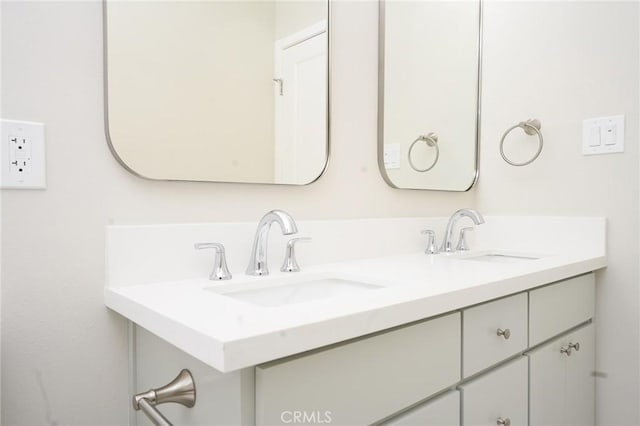 bathroom with double vanity and a sink