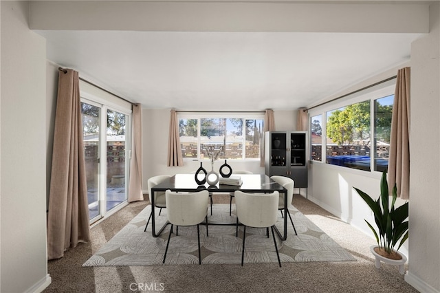 view of carpeted dining area