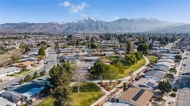 birds eye view of property featuring a mountain view