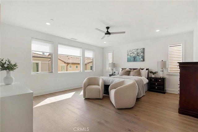 bedroom featuring ceiling fan and light hardwood / wood-style floors