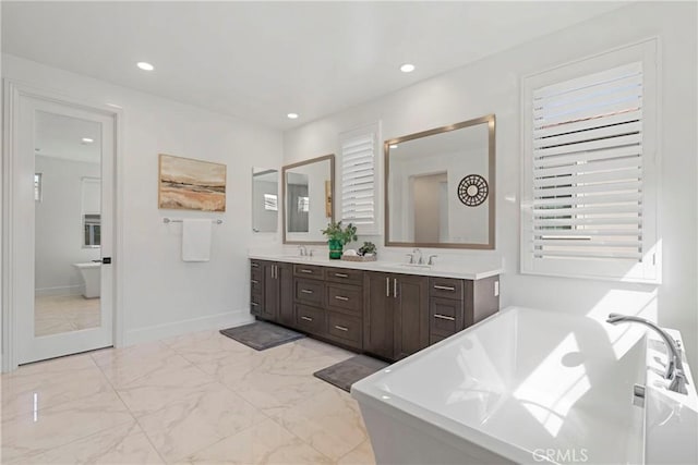 bathroom with a bathtub and vanity