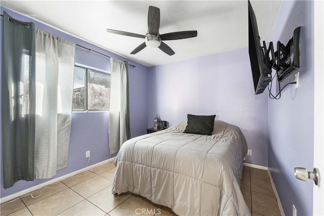 tiled bedroom featuring ceiling fan