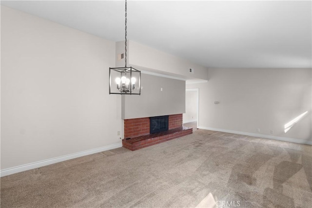 unfurnished living room with carpet floors, a fireplace, and baseboards