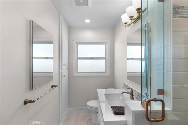 full bath with baseboards, visible vents, toilet, tile patterned floors, and vanity