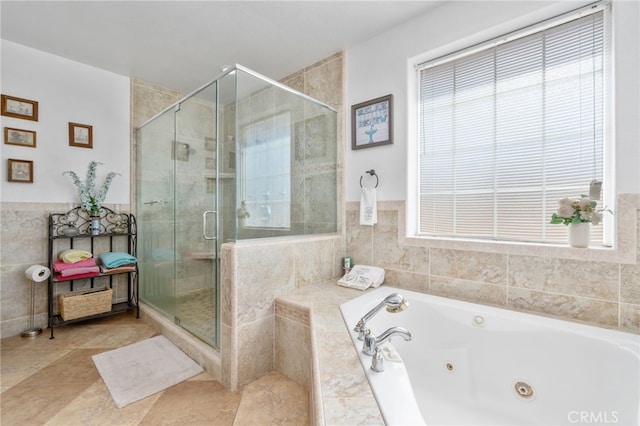 bathroom with separate shower and tub