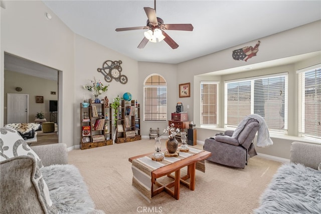 carpeted living room featuring plenty of natural light and ceiling fan