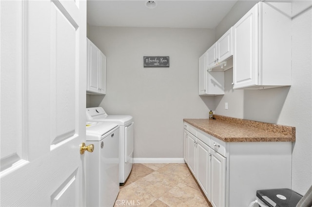 laundry room with cabinets and washer and dryer