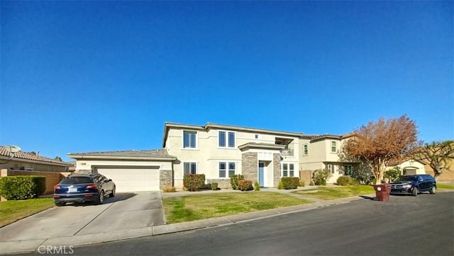 view of front of house with a front lawn and a garage