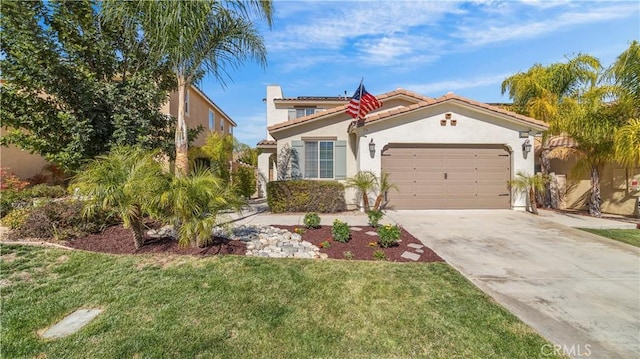 mediterranean / spanish home with driveway, stucco siding, a tile roof, an attached garage, and a front yard