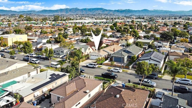 drone / aerial view with a residential view and a mountain view