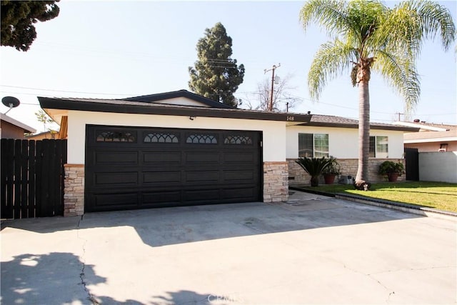 ranch-style house featuring driveway, a garage, stone siding, fence, and stucco siding