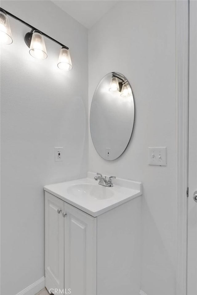 bathroom featuring vanity and baseboards