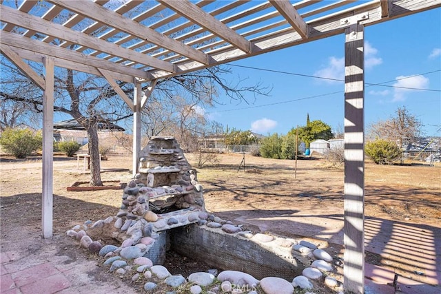 view of patio / terrace with fence and a pergola