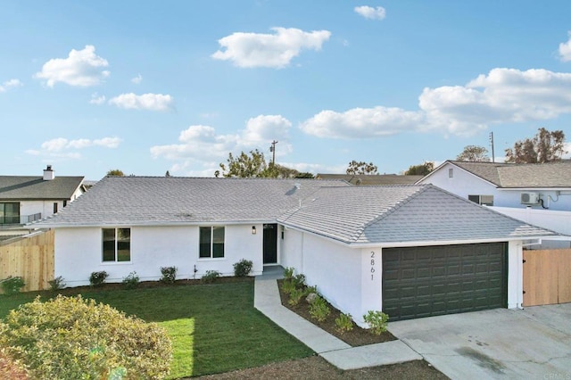 single story home with a front lawn and a garage