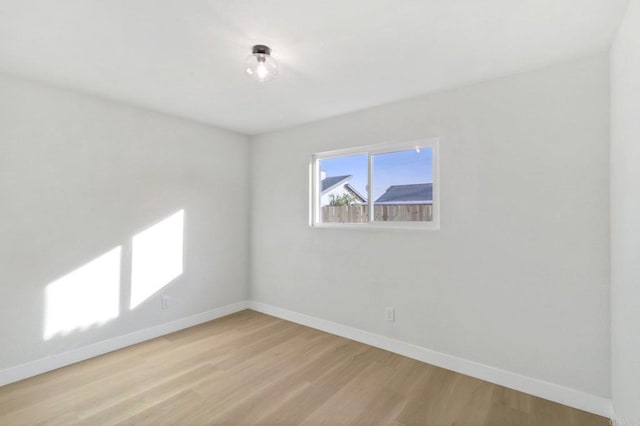 unfurnished room with light hardwood / wood-style floors