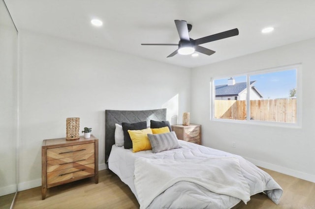 bedroom featuring light wood-type flooring and ceiling fan