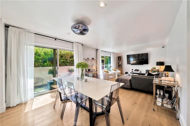 dining room featuring light wood-style floors