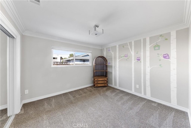 empty room with carpet flooring and ornamental molding