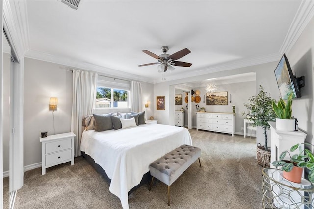 carpeted bedroom featuring ornamental molding and ceiling fan