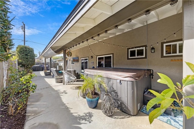 view of patio featuring a hot tub