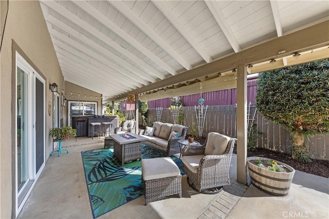 view of patio / terrace featuring an outdoor living space with a fire pit