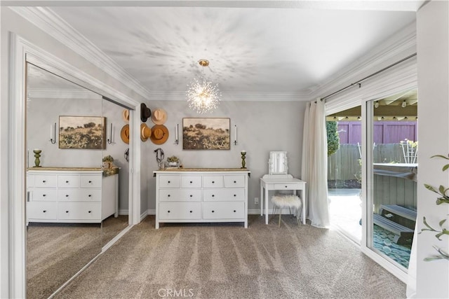 unfurnished room featuring ornamental molding, dark colored carpet, and an inviting chandelier