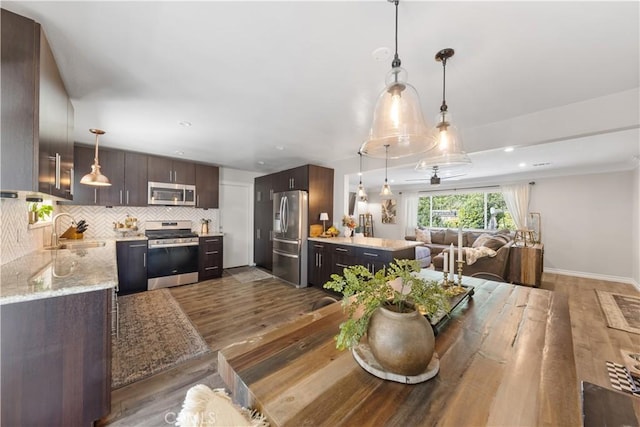 dining area featuring hardwood / wood-style floors and sink