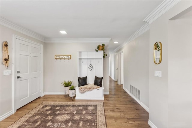 mudroom with crown molding and hardwood / wood-style floors