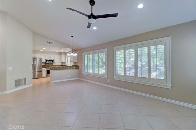 unfurnished living room featuring light tile patterned floors, ceiling fan, vaulted ceiling, and visible vents