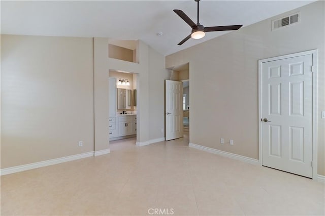 unfurnished bedroom with visible vents, baseboards, connected bathroom, and light tile patterned floors