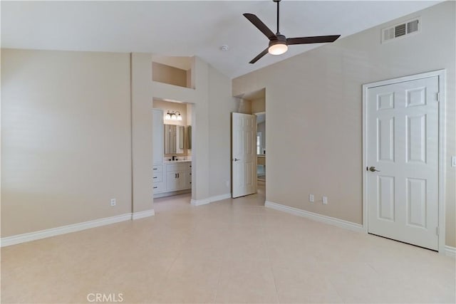 15 Embassy Pl, Lake Forest, CA 92610 - unfurnished bedroom featuring light tile patterned floors, ensuite bathroom, high vaulted ceiling, and a ceiling fan