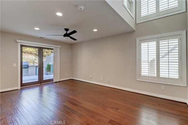 empty room with recessed lighting, a ceiling fan, baseboards, french doors, and dark wood-style floors