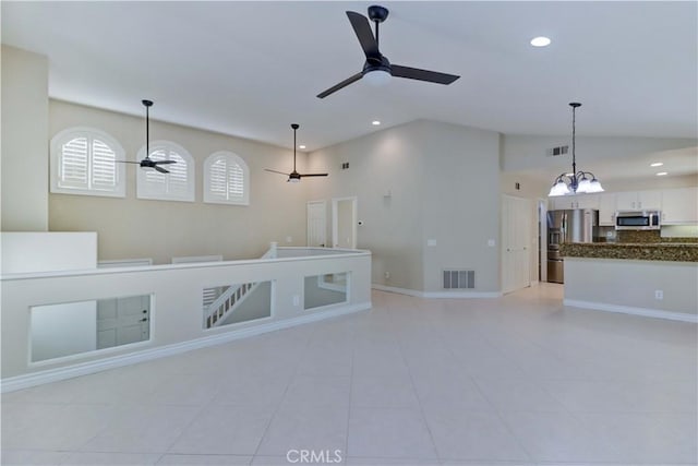 15 Embassy Pl, Lake Forest, CA 92610 - unfurnished room featuring a ceiling fan, vaulted ceiling, recessed lighting, light tile patterned floors, and a chandelier
