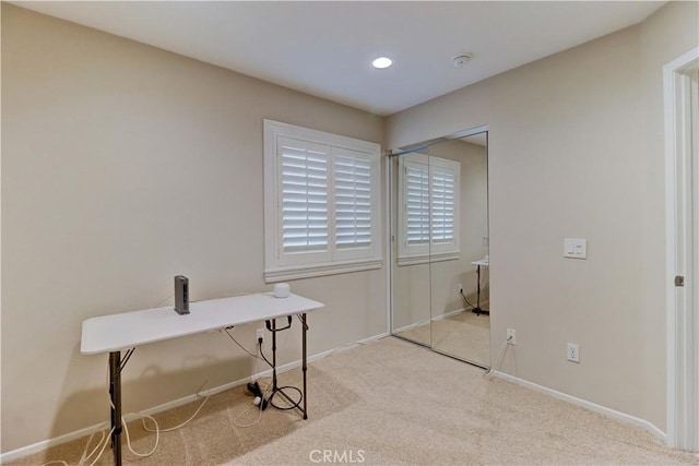 home office with recessed lighting, light carpet, and baseboards