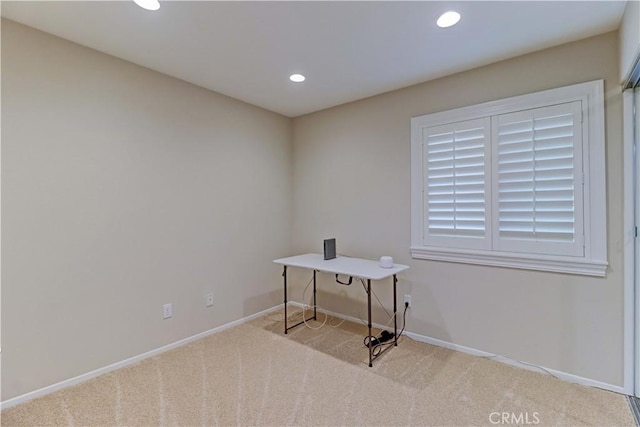carpeted office space featuring baseboards and recessed lighting