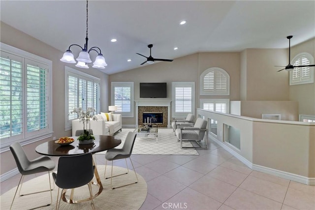 15 Embassy Pl, Lake Forest, CA 92610 - dining space featuring a ceiling fan, a high end fireplace, recessed lighting, vaulted ceiling, and light tile patterned floors