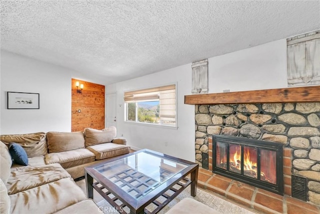 living room featuring a fireplace, lofted ceiling, and a textured ceiling