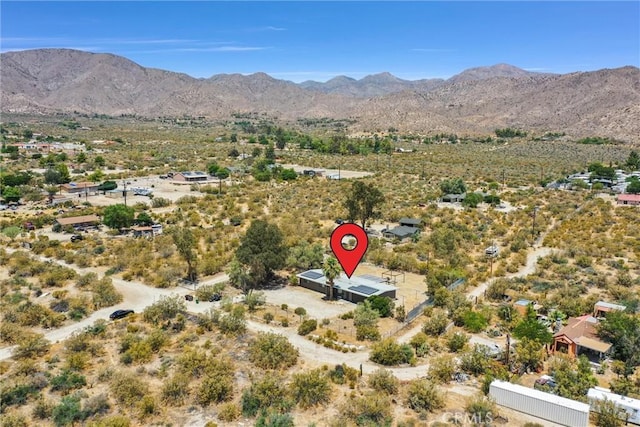 drone / aerial view featuring a mountain view